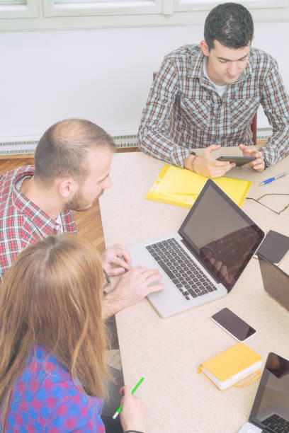 istock Group of people discussing business plans, with lap-tops. 685554370