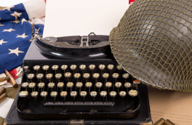istock US military helmet of the Second World War with old typewriter 685554690