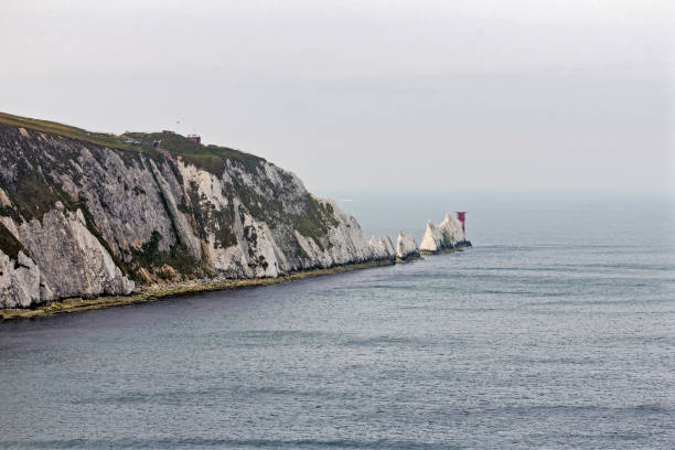 istock White chalk cliffs of Alum Bay, the Needles and Trinity Lighthouse 685555052