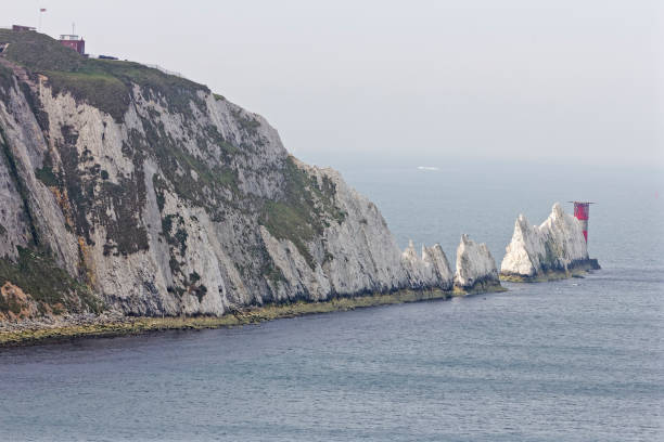 istock The white chalk cliffs, the Needles and Trinity Lighthouse on a hazy day. 685555056