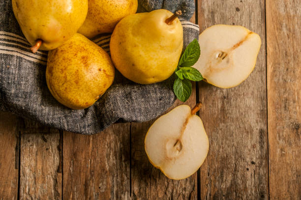 istock fresh ripe organic pears on a rustic wooden table 685562180