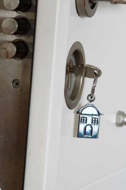istock House key in a lock with house icon on it 685568622