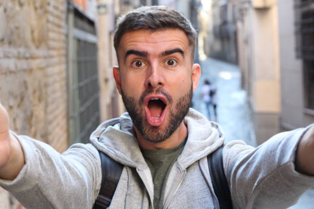 istock Man taking a selfie showing surprise 685572336