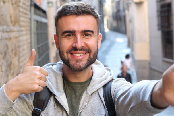 istock Handsome man taking selfie with thumbs up 685572354