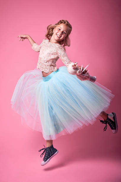 istock Cheerful girl in beautiful clothes posing in studio. Life style. Joy. Colored clothes 685586828