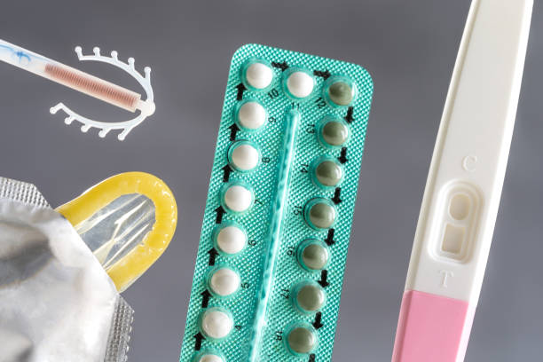 concept with oral contraceptive, emergency pills, injection contraceptive and male condom. - contraceção imagens e fotografias de stock