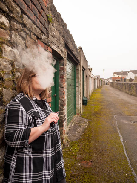istock Mature Woman Smoking an Electronic Cigarette 685596646