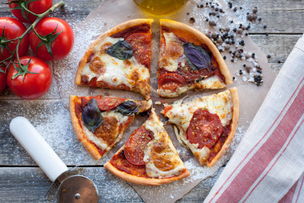 istock rustic italian pizza with mozzarella, cheese and basil leaves 685609570
