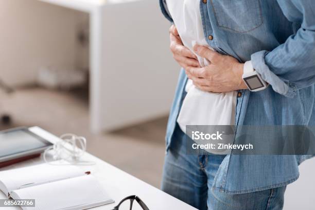 Photo Of Male Having Pain In Belly Stock Photo - Download Image Now - Stomachache, Abdomen, Men