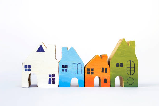istock Wooden miniature house collections on white background 685635358