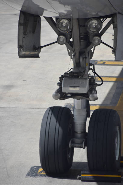 Aeroplane wheel landing on a wet tarmac