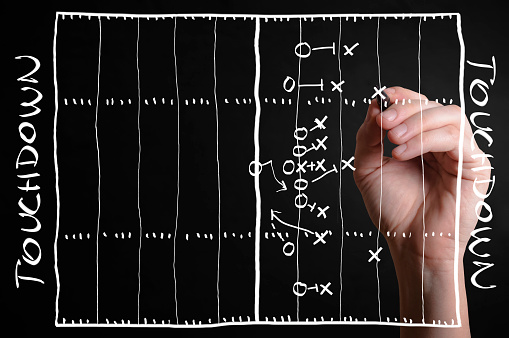 Hand drawn an American football strategy plan on a virtual screen