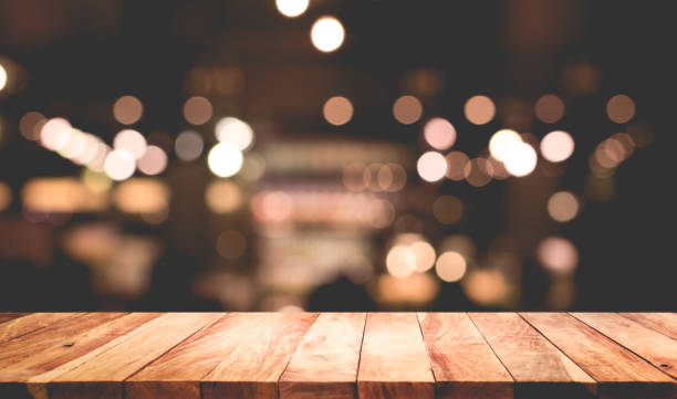 istock Wood table with blur light in night cafe,restaurant background 685667878