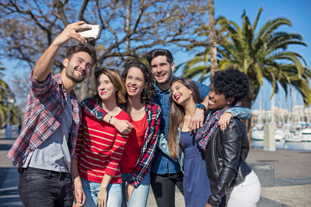 istock Young friends taking selfie at harbor on sunny day 685668230