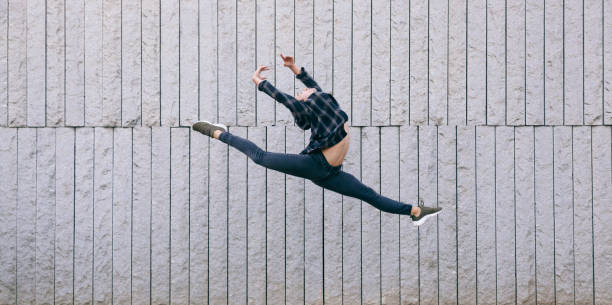 istock young male dancer performing a ballet jump 685668712