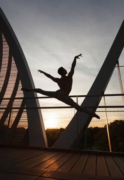 istock athletic man performing a ballet jump with arms and legs wide open 685668714