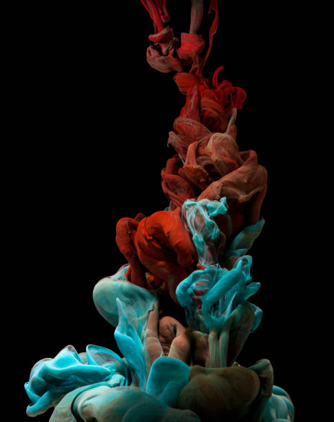 istock Coloured inks moving in water on black background 685685370