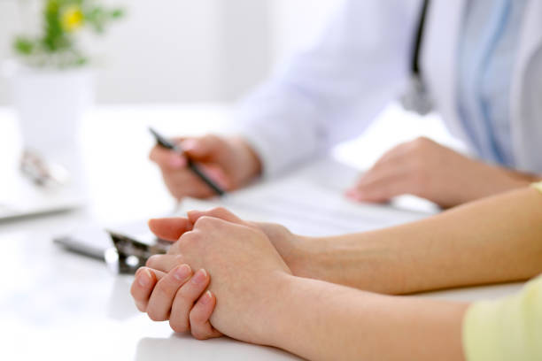 istock Doctor and patient are discussing something, just hands at the table 685685594