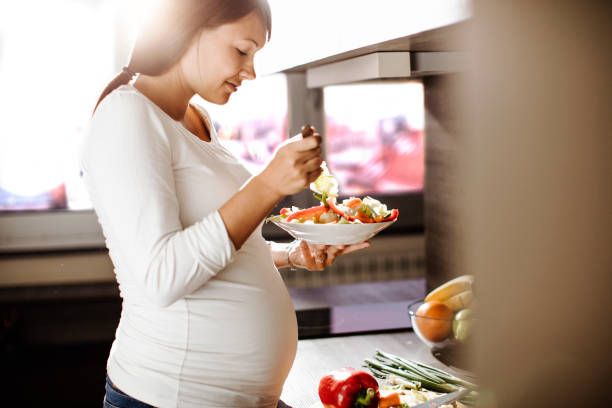 istock Future mother eating healthy food 685688998