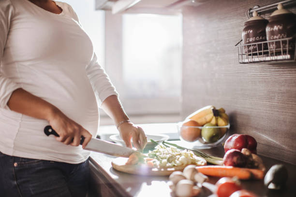 istock Pregnant woman making a meal 685689010
