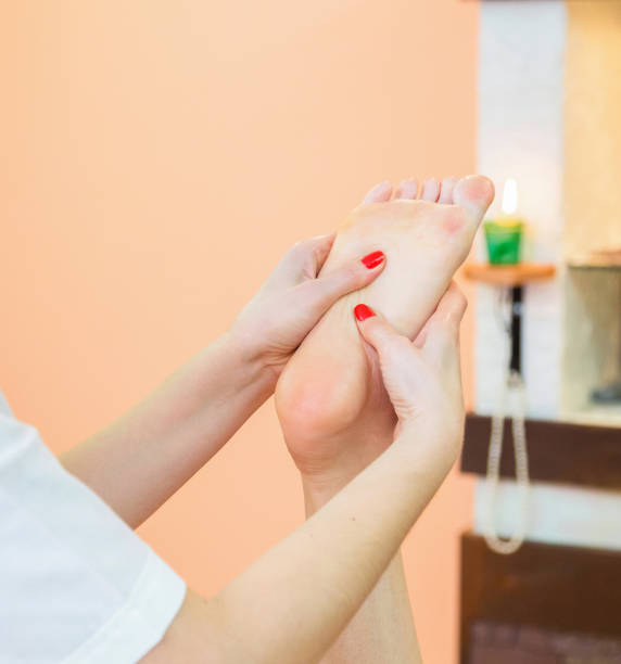 istock Masseur kneads the foot client. 685693566