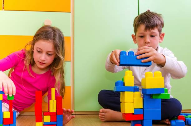 istock Children playing with construction toy blocks 685694878