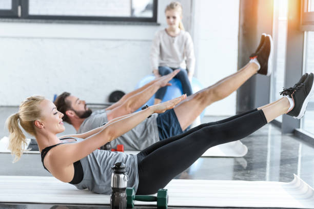 istock People doing gymnastics at fitness studio 685704614