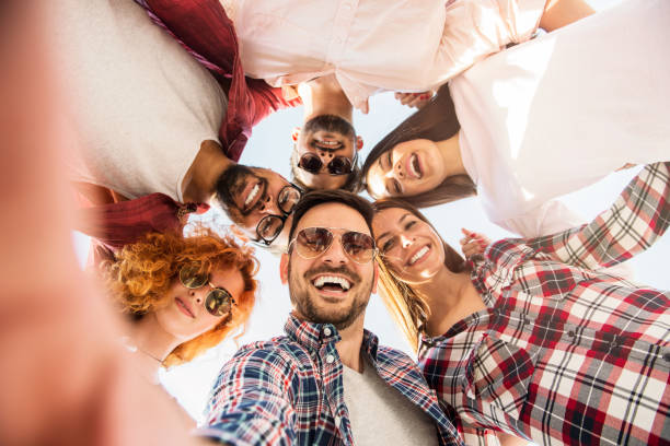 istock Group of young people standing in a circle, outdoors, having fun 685726498