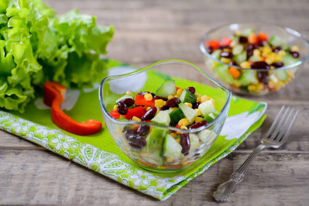 istock Fresh spring salad with sweet pepper, cucumbers and haricot 685726576
