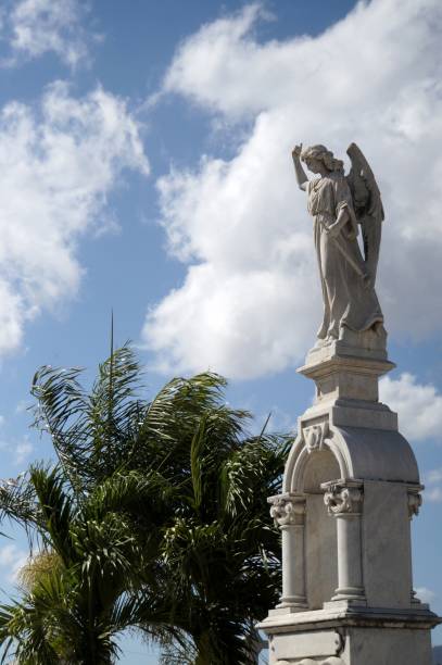 istock White marble statues at the cemetery 685734880