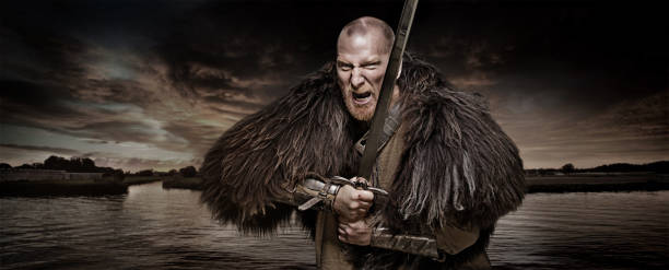 istock Sword wielding bloody viking warrior in studio shot 685736014