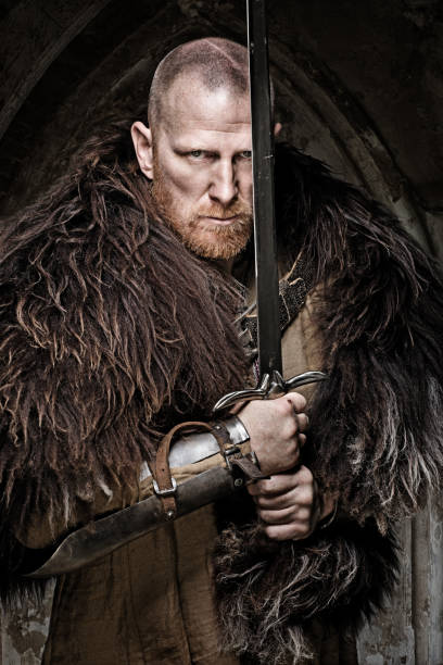 istock Sword wielding viking warrior in emotional pose 685736042