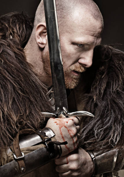 istock Sword wielding viking warrior in emotional pose 685736094