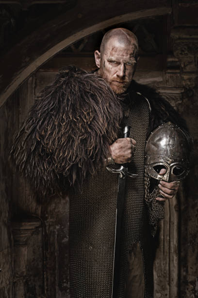istock Sword wielding bloody viking warrior in emotional pose 685736138