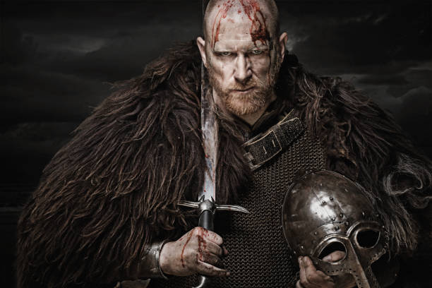 istock Sword wielding bloody viking warrior in studio shot 685736162
