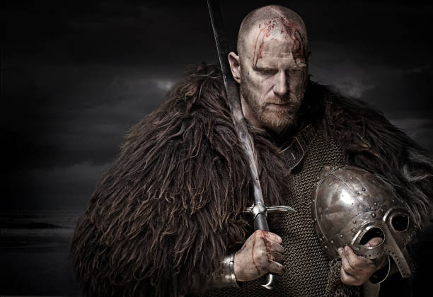 istock Sword wielding bloody viking warrior in studio shot 685736282