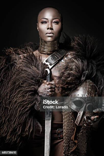 Beautiful Black Warrior Princess Holding A Sword In Studio Shot Stock Photo - Download Image Now