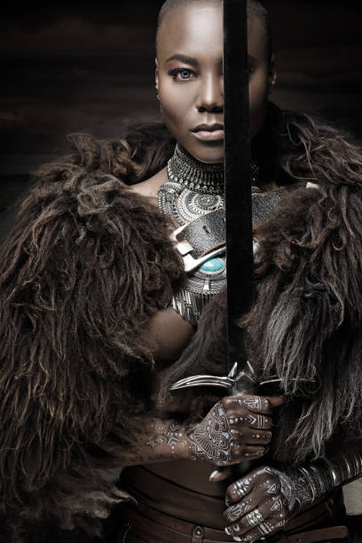 istock Beautiful black warrior princess holding a sword in studio shot 685740674