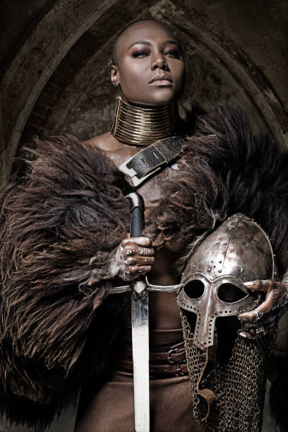 istock Beautiful black warrior princess holding a sword in studio shot 685740736