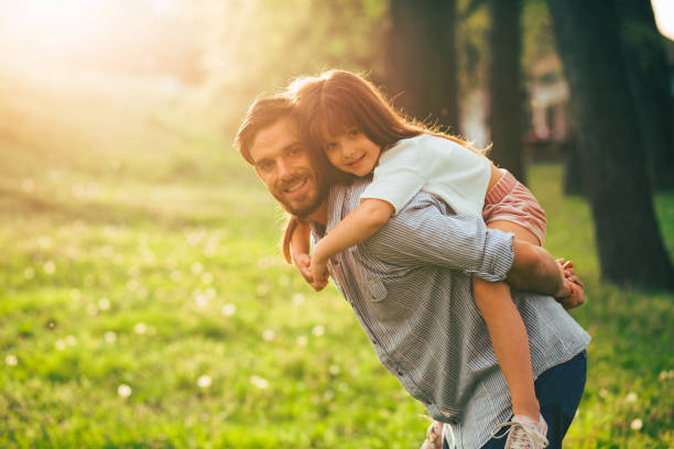 istock Smiling father giving his daughter piggyback ride. 685741724