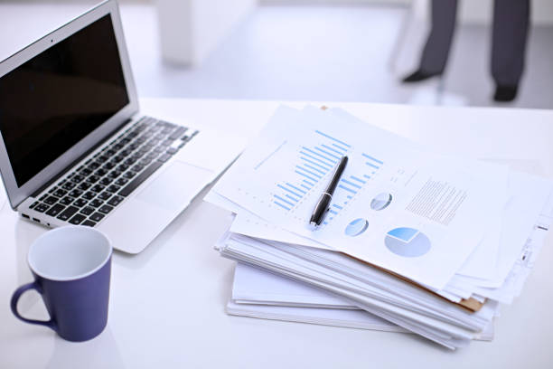 istock Office workplace with a laptop and financial documents 685756960