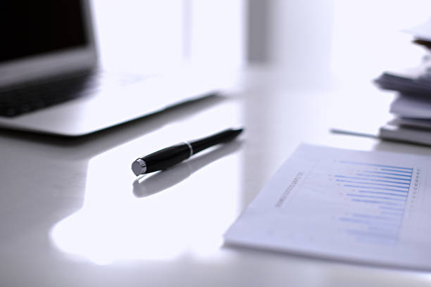 istock Office workplace with a laptop and financial documents 685757428