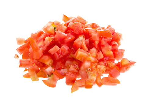 Chopped tomatoes on white background.