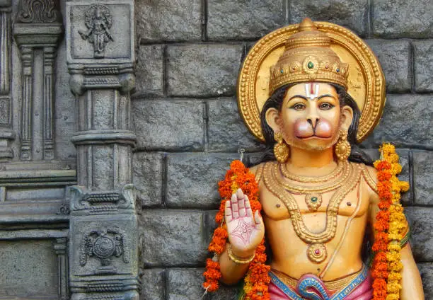 Photo of idol of Hindu God Hanuman idol on motor vehicle mobile temple, Hyderabad,India.