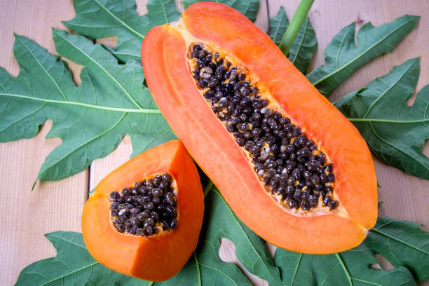 istock sweet papaya fruit on wooden background. 685761252