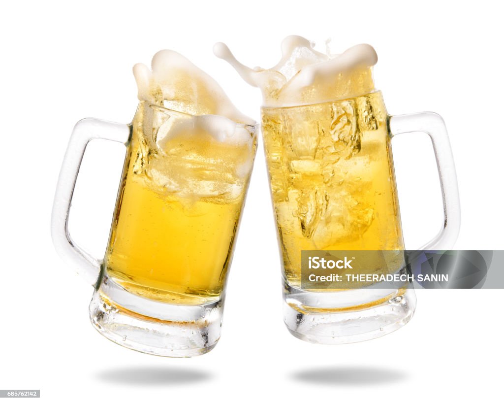 Cheering beer Cheers cold beer with splashing out of glasses on white background. Beer Glass Stock Photo