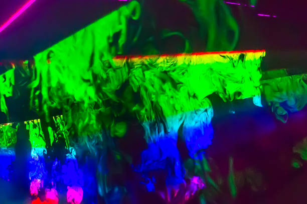 Image of the reflecting surface of shiny object illuminated with sun light. Abstract spectrum background