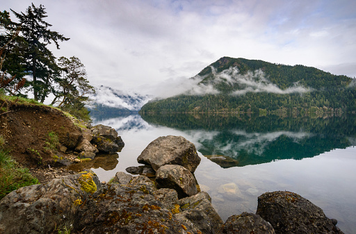 Morning fog rolling through the inlet of Lake Crescent at Olympic National Park