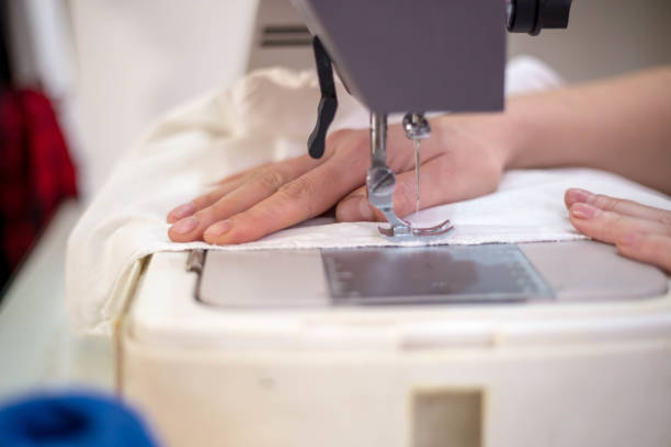 istock Seamstress woman preparing material 685772352