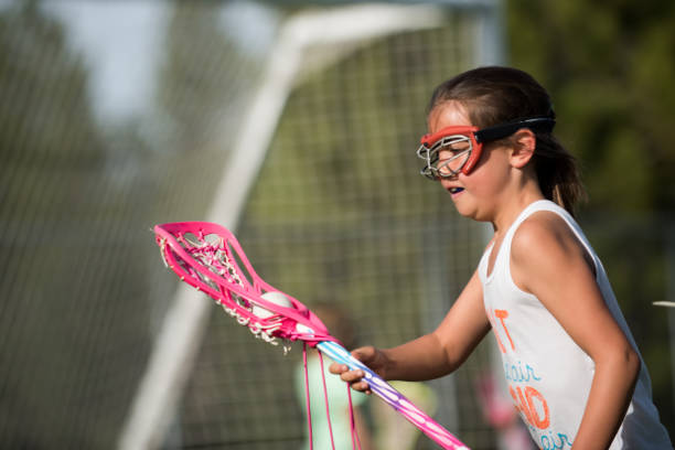 istock Young girl learning to play lacrosse 685772704